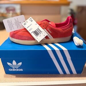 Adidas KIDS Originals Samba in red with white accents and a gum sole.